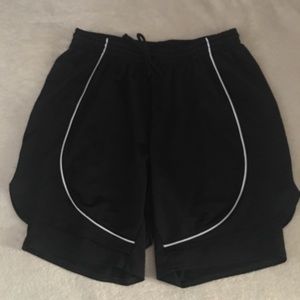 Junonia Active 1X layered black shorts.